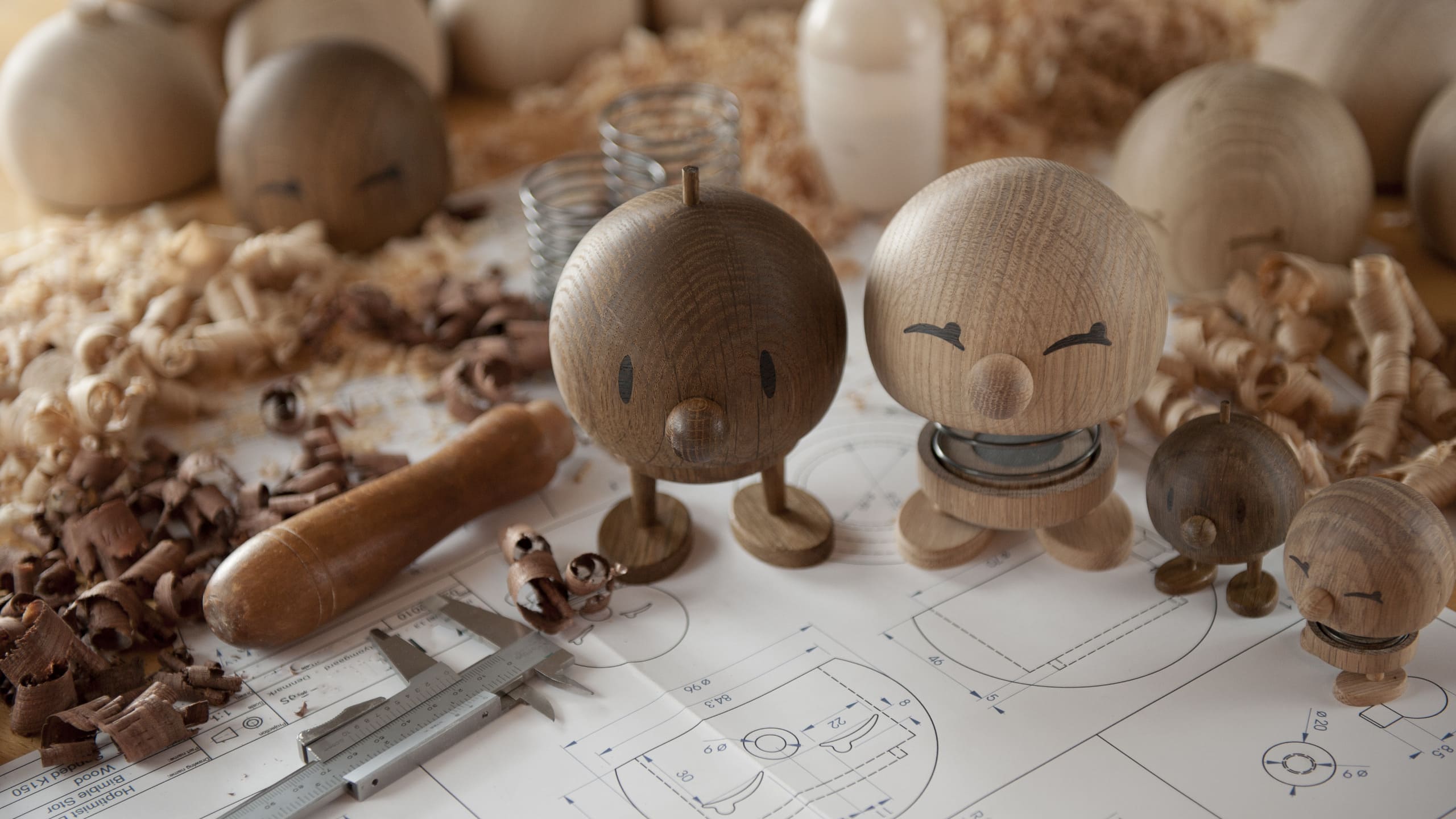 Wooden Hoptimist on blueprints